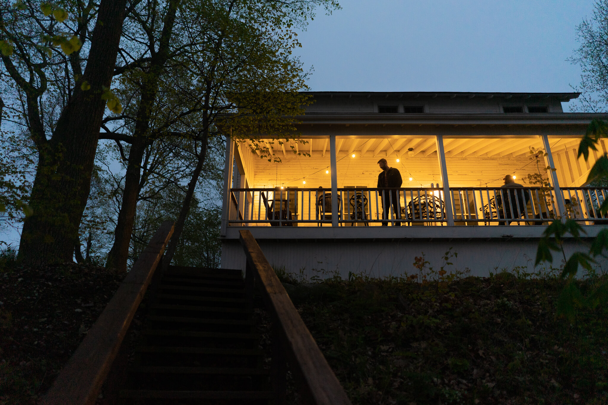 A spacious porch, original to the house, overlooks Lake Maxinkuckee from atop the area’s tallest bluff.