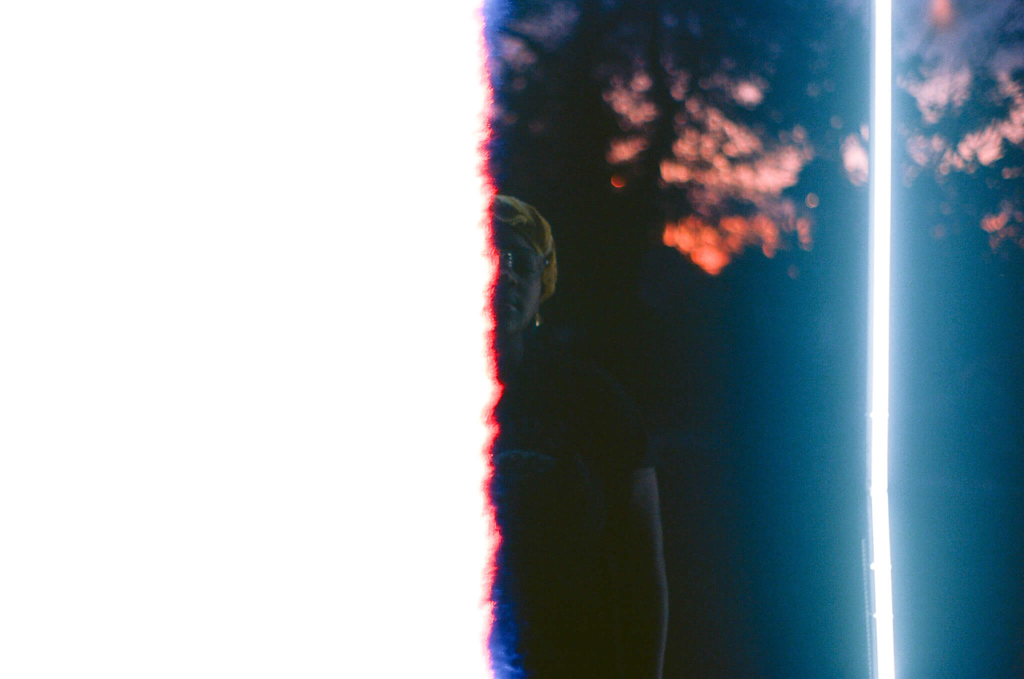 GIIIVENS inside their light sculpture.