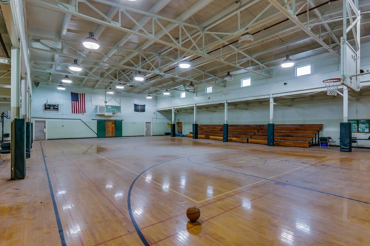 The Armory’s gymnasium, now the event hall, before restoration.